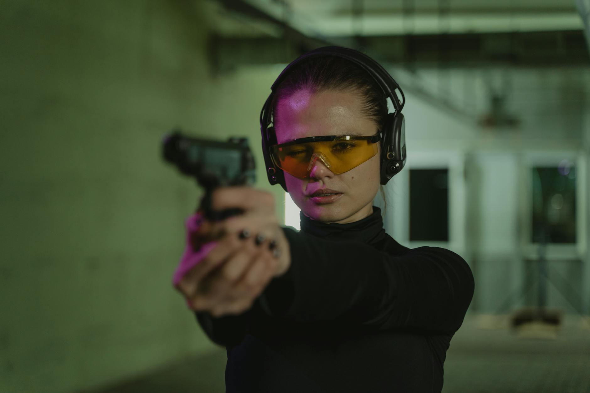 a woman holding a gun